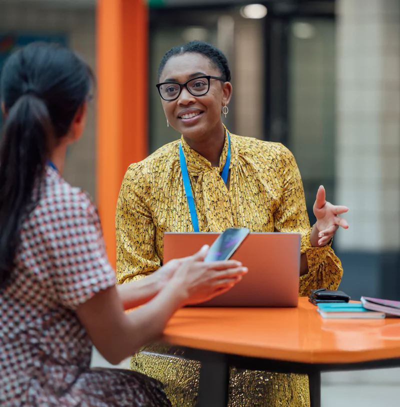 A school leader is chatting