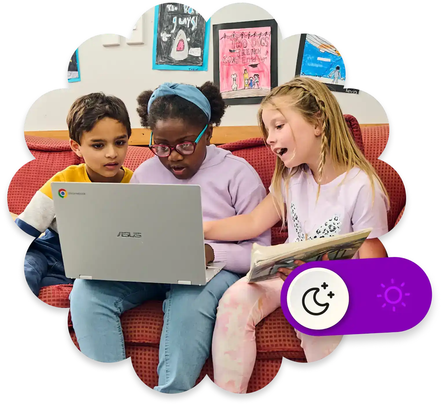 Three children sit closely together on a couch, looking at a laptop screen with interest. Colorful artwork is displayed on the wall behind them. One girl holds a book and gestures excitedly.