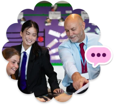 A school leader is talking to two students