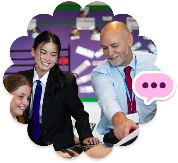 A school leader is talking to two students