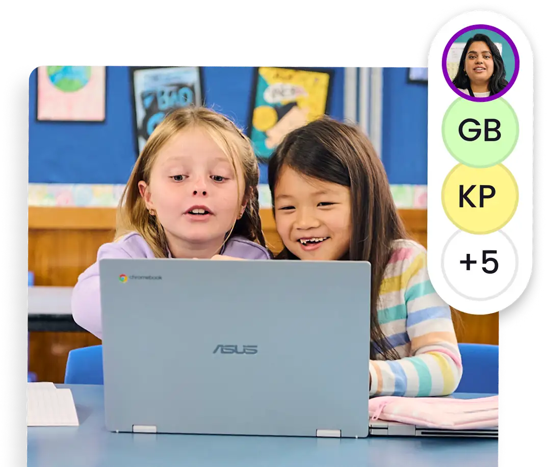 Two students are collaborating with each other in a class