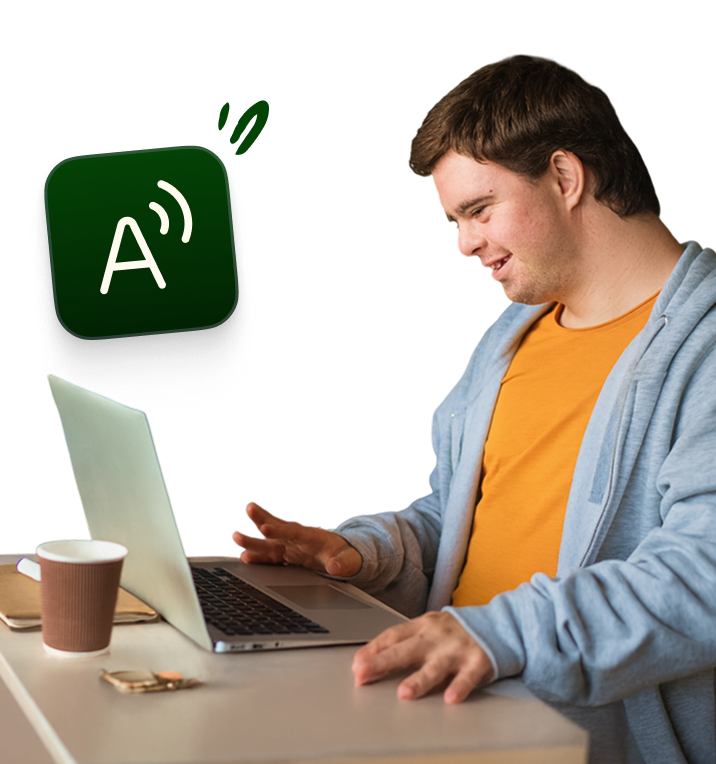 Person using a laptop at a table, with a green speech-to-text/audio icon floating beside them.