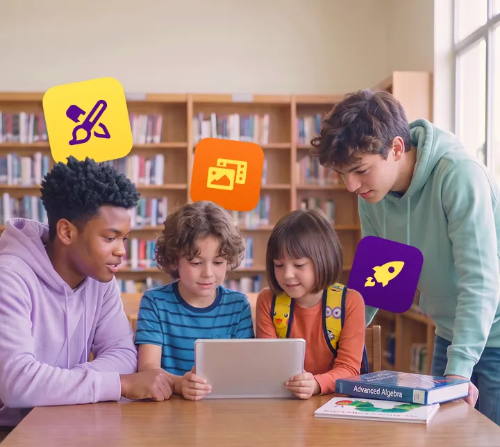Students in a library reviewing a digital portfolio