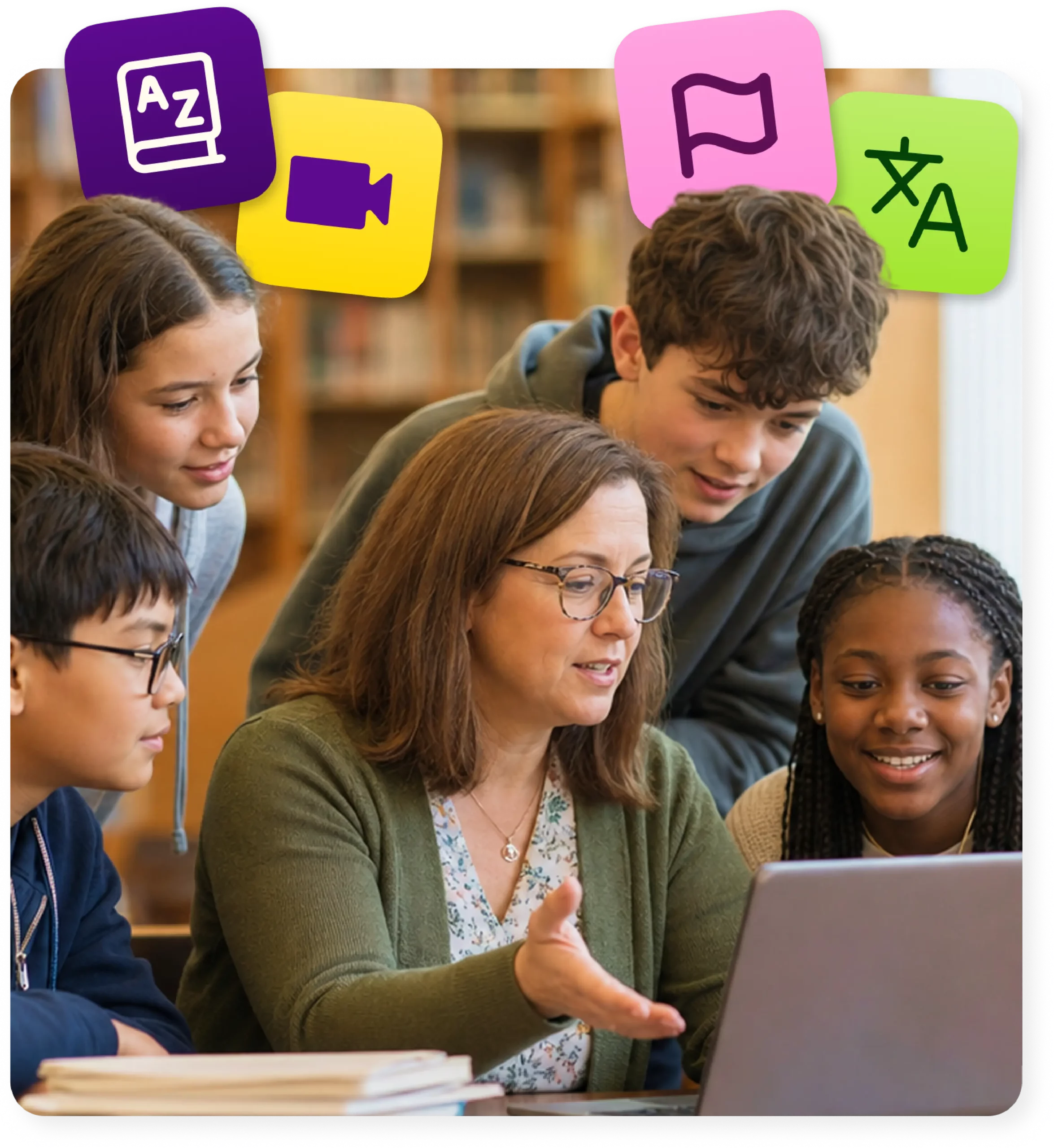 A school librarian at a laptop explains something to four students gathered around her.