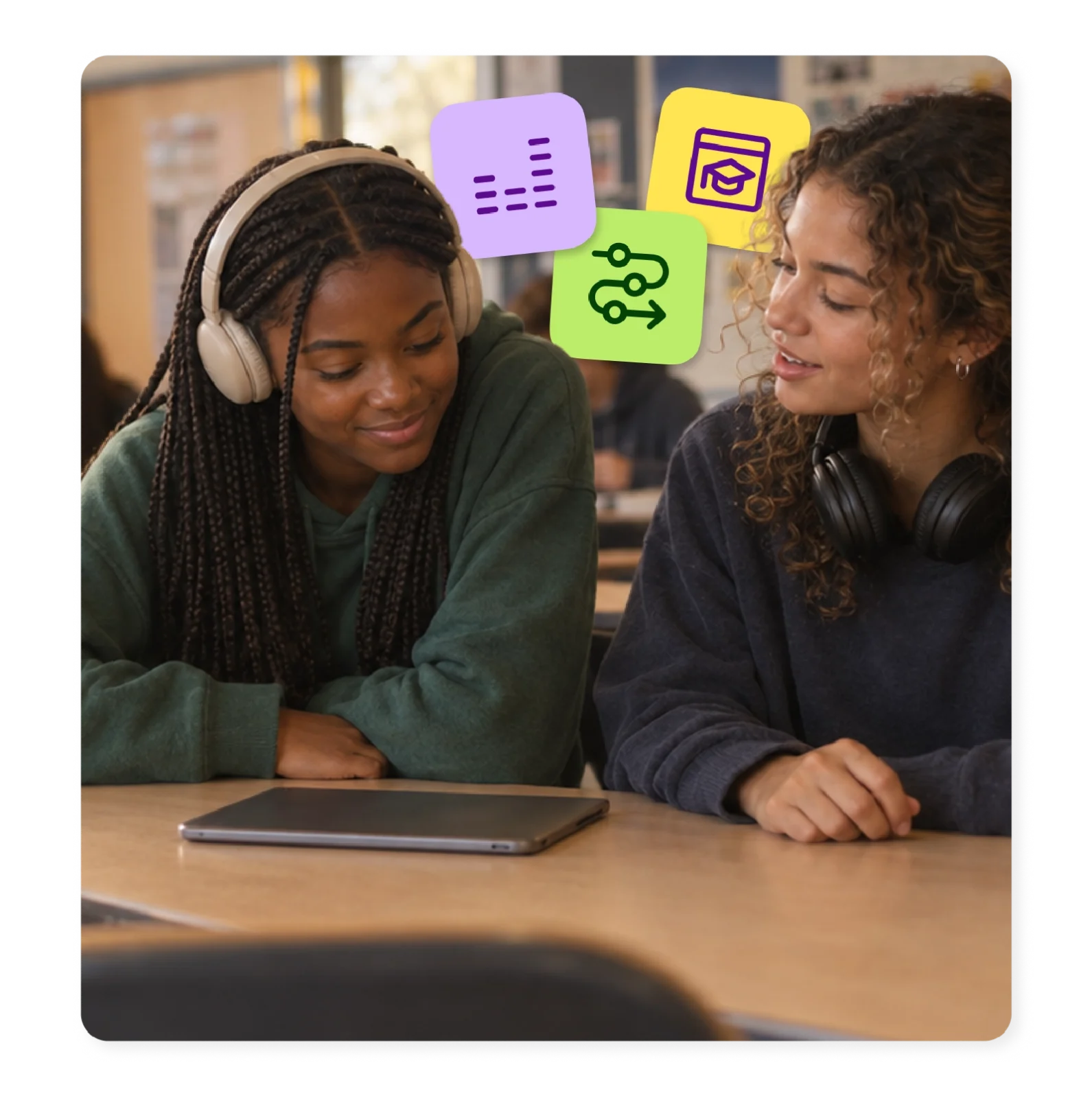 Two students with headphones reviewing their reading practice on a tablet