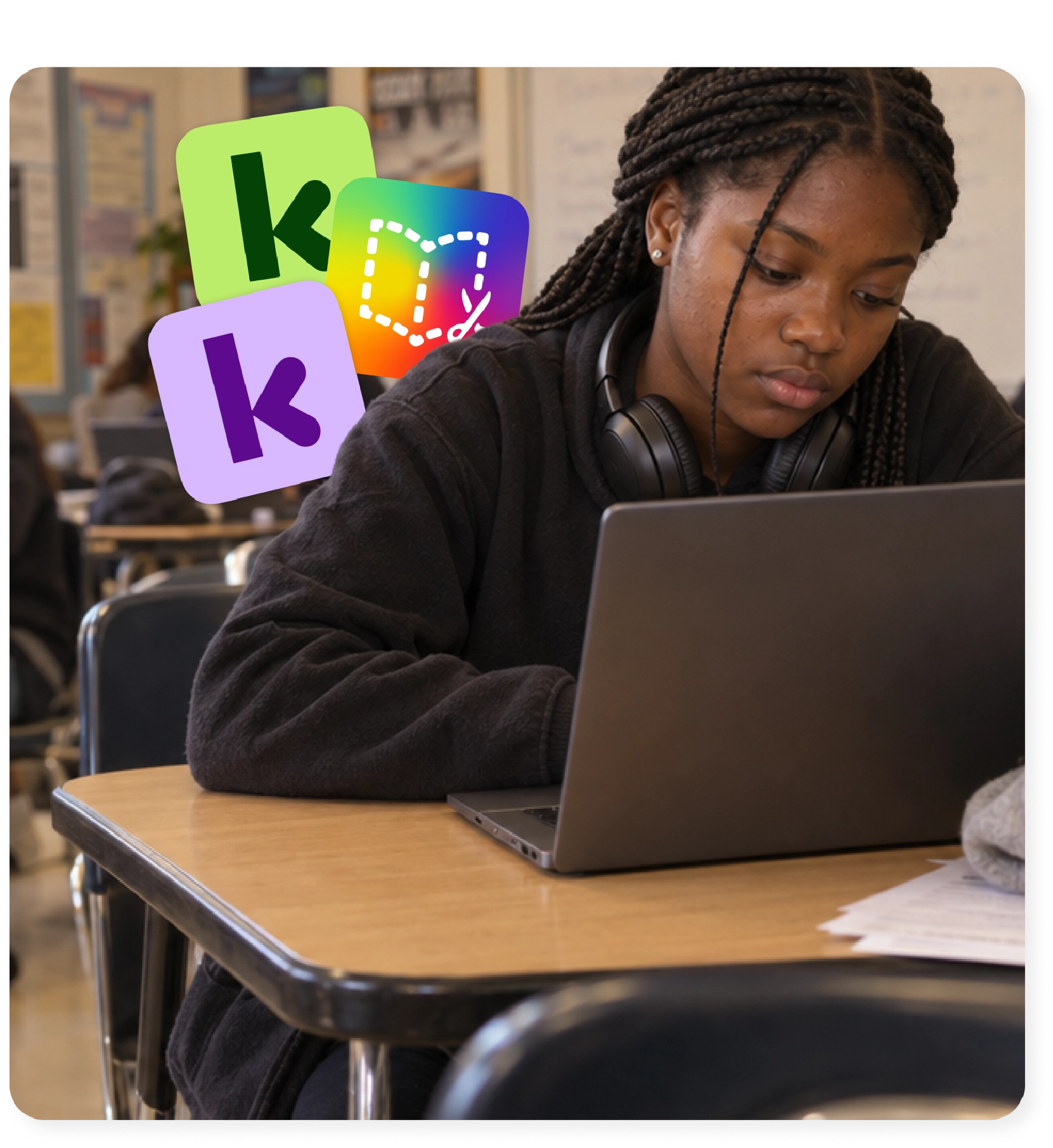 Student with headphones practicing reading fluency on a laptop in class.