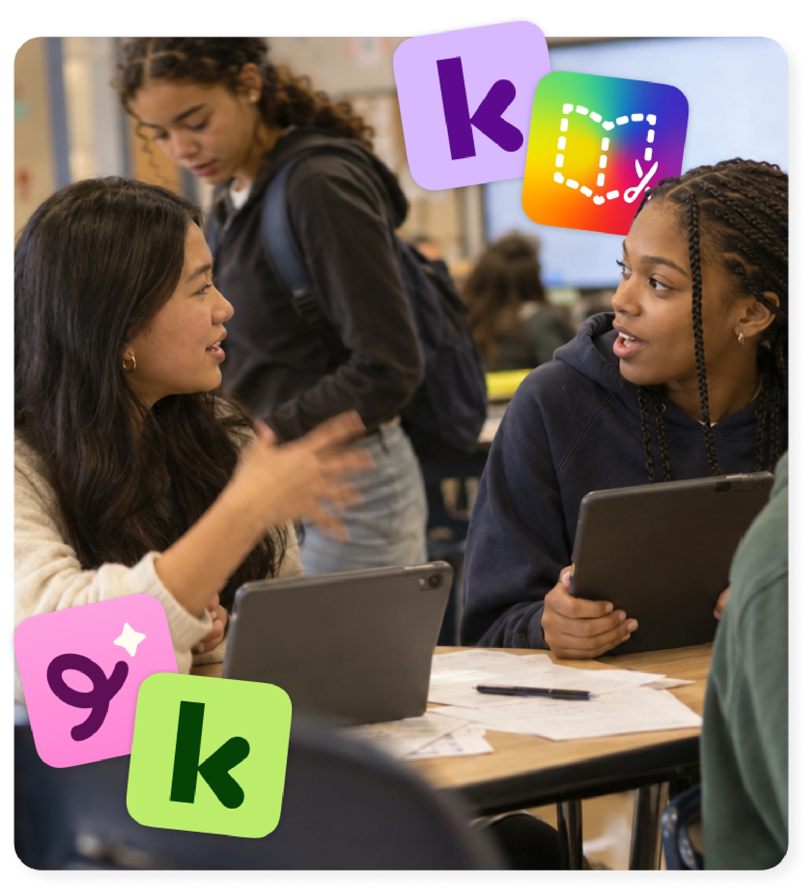 Students discuss their work on tablets using blended learning tools from the Kami family.