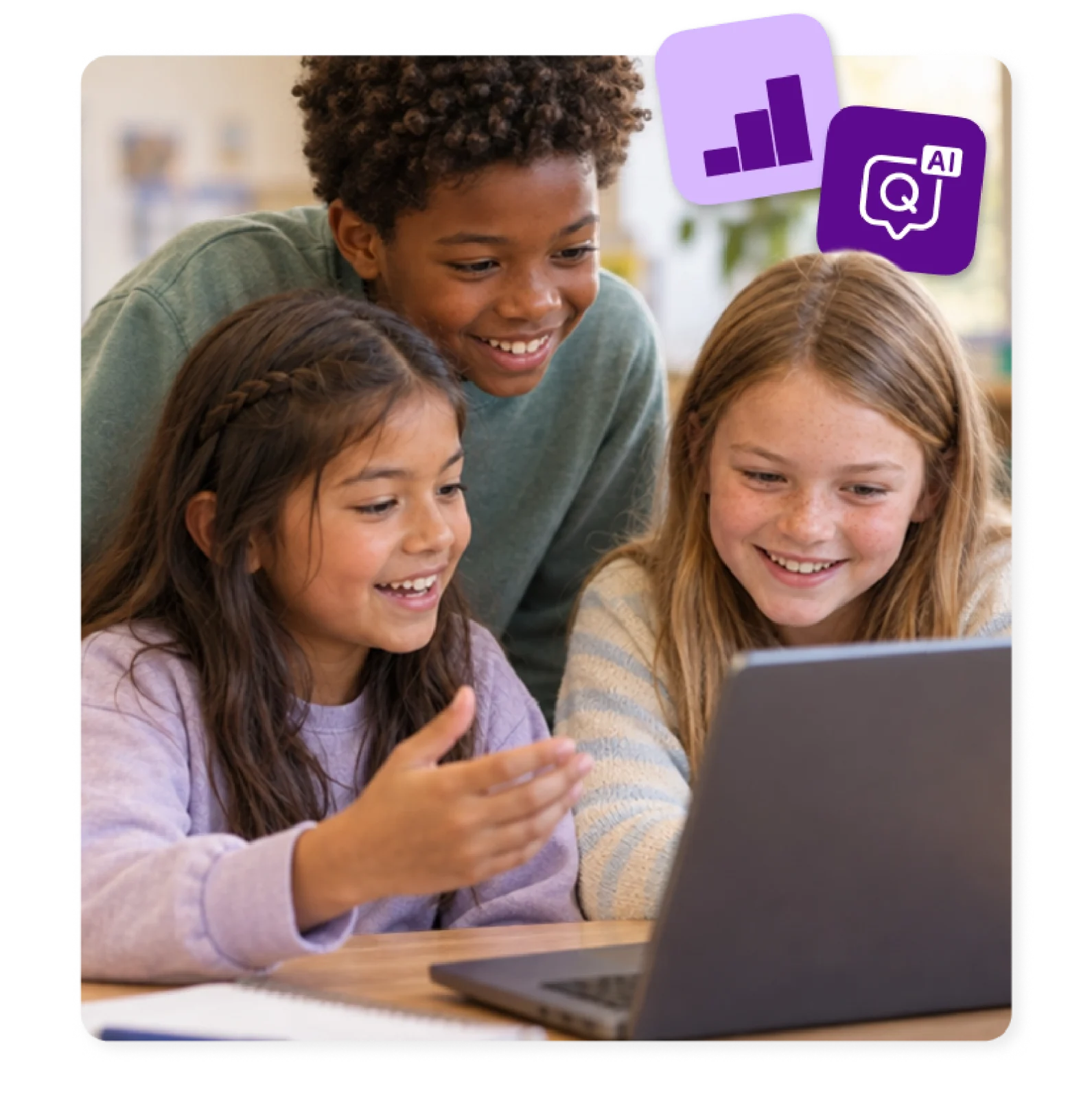 Three students check their results on a laptop, assessed with Kami’s AI grading tool for teachers.