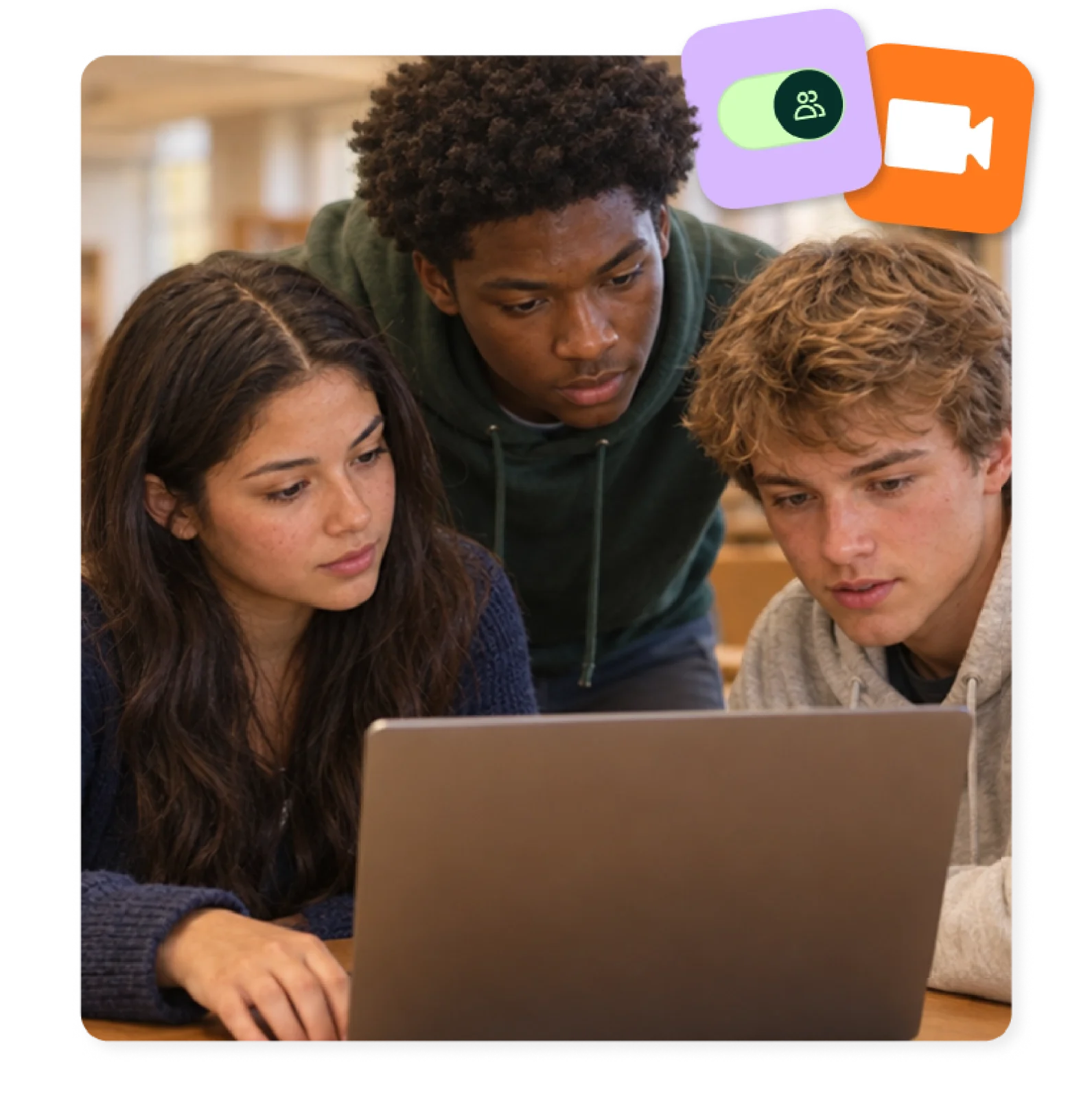 Three students gather around a laptop to work through a collaborative learning task.