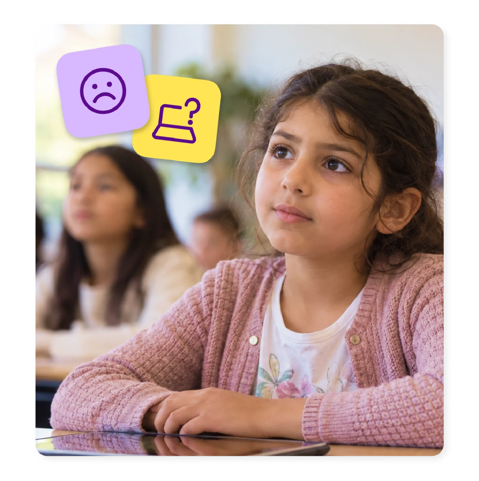 An elementary student sits at her desk with a tablet, looking unsure.